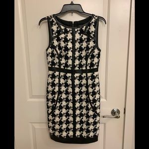 Laundry tweed dress with leather trim.